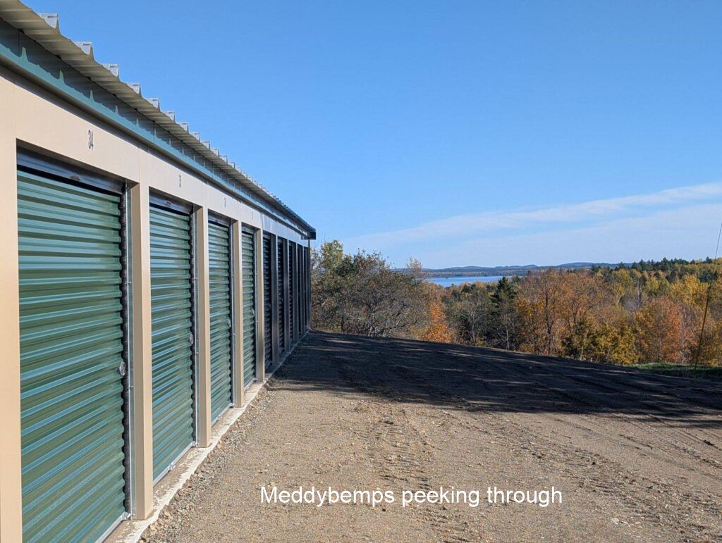 Sideview of building with Meddybemps Lake peeking out